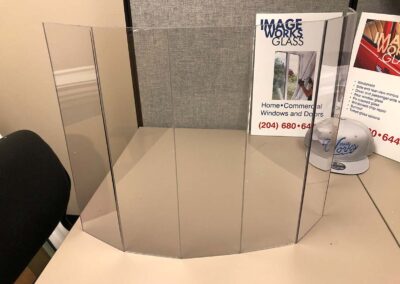 Curved, transparent barrier for protection